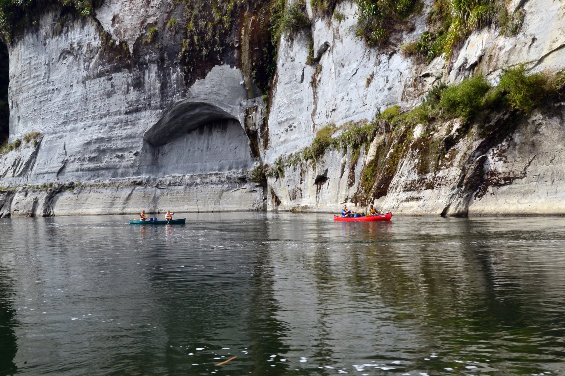 The Whanganui runs between cliffs of papa, a soft grey mudstone, and waterfalls pour off them after rain